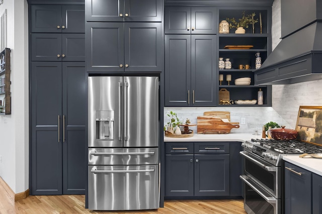95 Highland Ct, Strafford, MO 65757 - kitchen featuring stainless steel appliances, open shelves, light wood-style floors, light countertops, and tasteful backsplash
