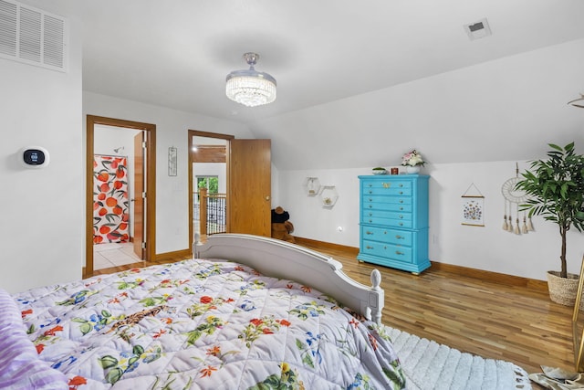 95 Highland Ct, Strafford, MO 65757 - bedroom with wood finished floors, lofted ceiling, and baseboards