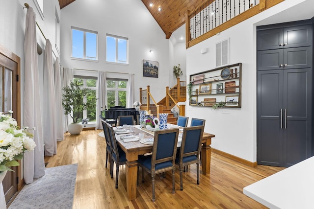 95 Highland Ct, Strafford, MO 65757 - dining room with high vaulted ceiling, stairs, light wood-style floors, baseboards, and wooden ceiling