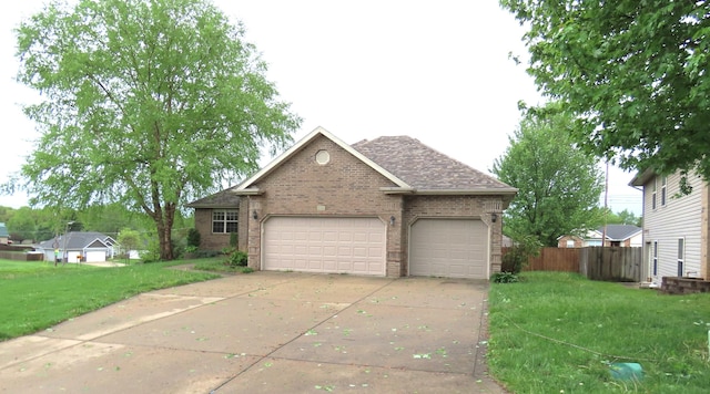 4972 E Cherry Cir, Springfield, MO 65809 - view of front of property with brick siding, concrete driveway, a garage, and a shingled roof