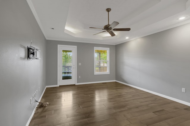 4972 E Cherry Cir, Springfield, MO 65809 - unfurnished room featuring dark wood-style flooring, a ceiling fan, a raised ceiling, baseboards, and ornamental molding
