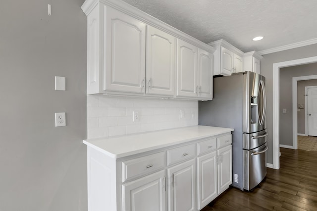 4972 E Cherry Cir, Springfield, MO 65809 - kitchen featuring stainless steel refrigerator with ice dispenser, decorative backsplash, white cabinets, baseboards, and dark wood finished floors