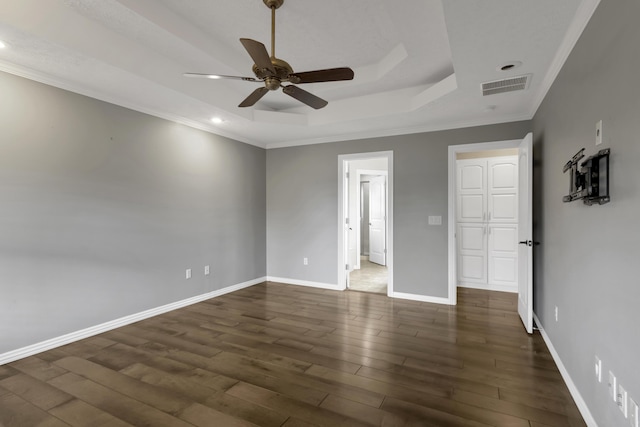 4972 E Cherry Cir, Springfield, MO 65809 - unfurnished bedroom featuring a tray ceiling, wood finished floors, recessed lighting, crown molding, and baseboards