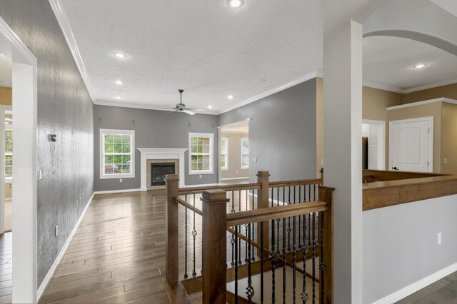 4972 E Cherry Cir, Springfield, MO 65809 - living room featuring a ceiling fan, baseboards, wood finished floors, recessed lighting, and ornamental molding