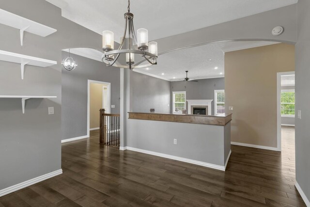 4972 E Cherry Cir, Springfield, MO 65809 - spare room with ceiling fan, baseboards, arched walkways, a chandelier, and plenty of natural light