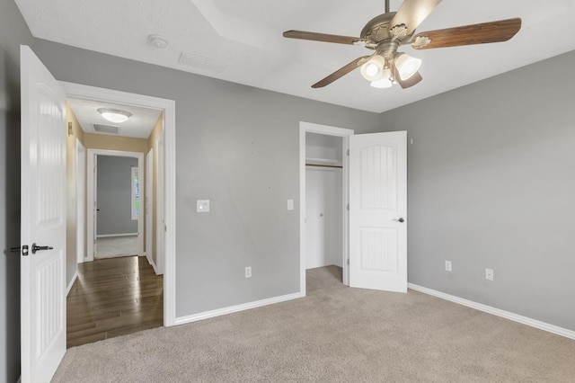 4972 E Cherry Cir, Springfield, MO 65809 - unfurnished bedroom featuring carpet floors, baseboards, a closet, and ceiling fan