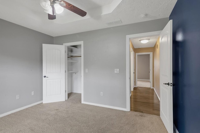 4972 E Cherry Cir, Springfield, MO 65809 - unfurnished bedroom with carpet flooring, baseboards, ceiling fan, and a closet