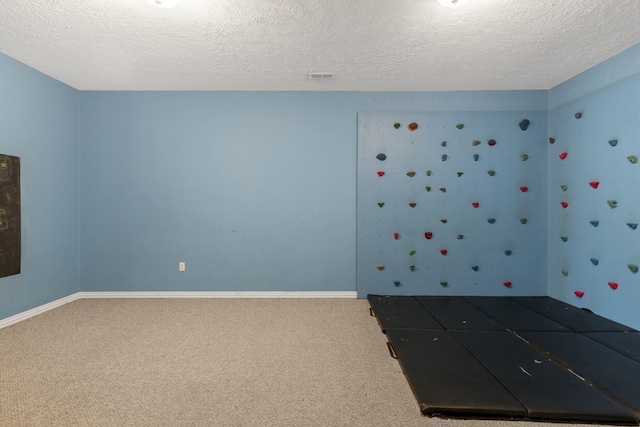 4972 E Cherry Cir, Springfield, MO 65809 - carpeted spare room with a textured ceiling and baseboards