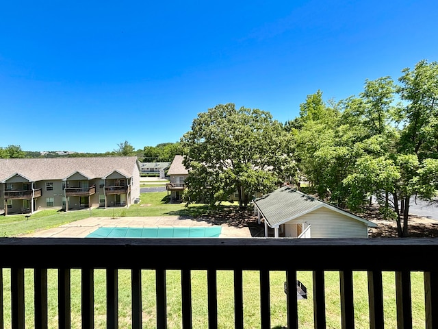 610 Abby Ln Par 61, Branson, MO 65616 - view of green lawn with a balcony and a covered pool