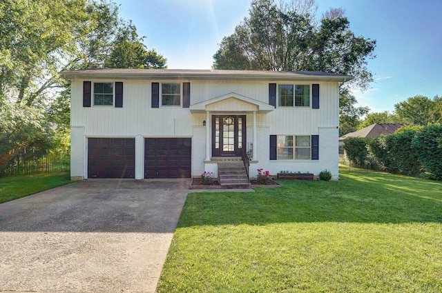 3625 S Moreland Ave, Springfield, MO 65807 - raised ranch featuring a garage, driveway, and a front lawn