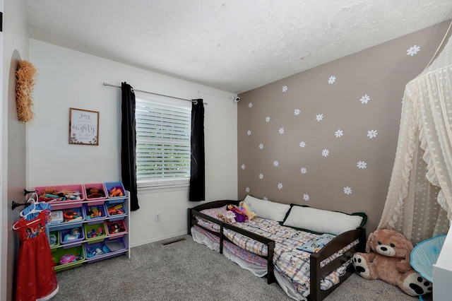 3625 S Moreland Ave, Springfield, MO 65807 - carpeted bedroom featuring a textured ceiling and baseboards
