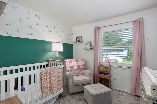 3625 S Moreland Ave, Springfield, MO 65807 - carpeted bedroom featuring a crib and baseboards