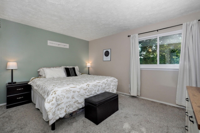 3625 S Moreland Ave, Springfield, MO 65807 - bedroom featuring a textured ceiling, light carpet, and baseboards