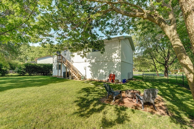 3625 S Moreland Ave, Springfield, MO 65807 - view of yard featuring stairs, an outdoor fire pit, and central AC unit