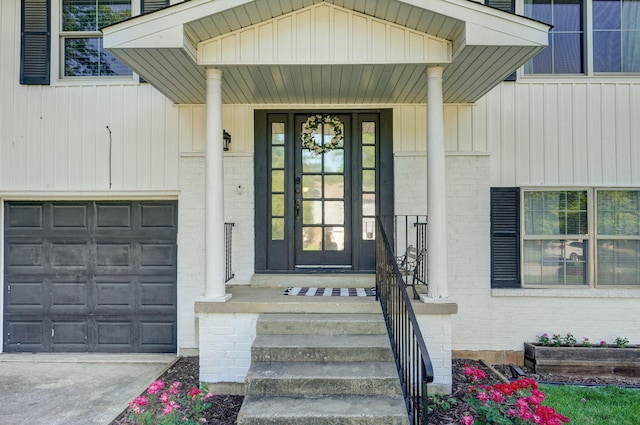 3625 S Moreland Ave, Springfield, MO 65807 - doorway to property with brick siding, board and batten siding, and concrete driveway