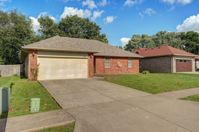 2852 S Pinehurst Ave, Springfield, MO 65807 - single story home with brick siding, a shingled roof, driveway, and a garage