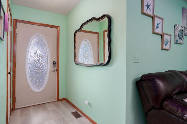 2852 S Pinehurst Ave, Springfield, MO 65807 - foyer entrance with light wood finished floors and baseboards