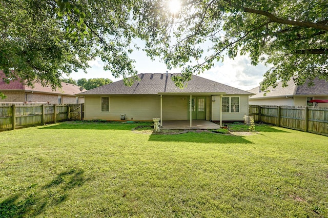 2852 S Pinehurst Ave, Springfield, MO 65807 - rear view of property featuring a patio, a fenced backyard, and a shingled roof