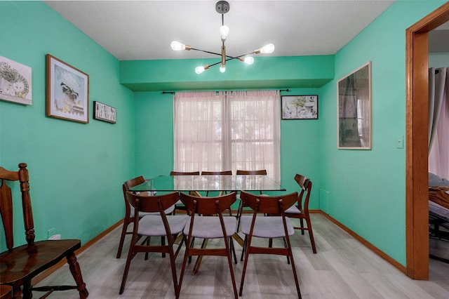 2852 S Pinehurst Ave, Springfield, MO 65807 - dining room featuring a chandelier and wood finished floors