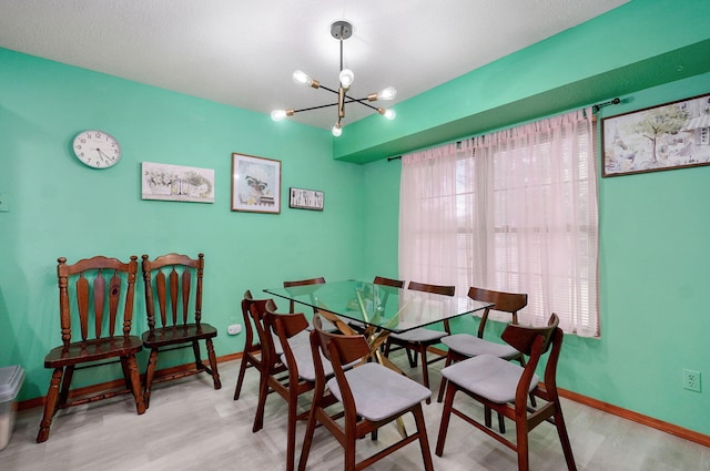2852 S Pinehurst Ave, Springfield, MO 65807 - dining area featuring a chandelier and wood finished floors