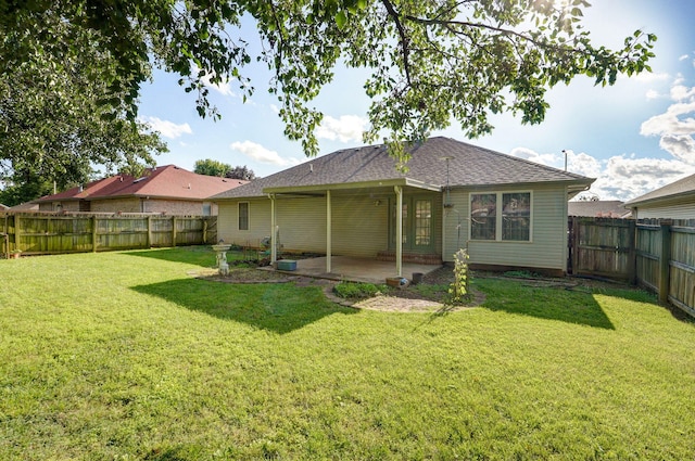 2852 S Pinehurst Ave, Springfield, MO 65807 - back of house with a patio area, a fenced backyard, and a shingled roof