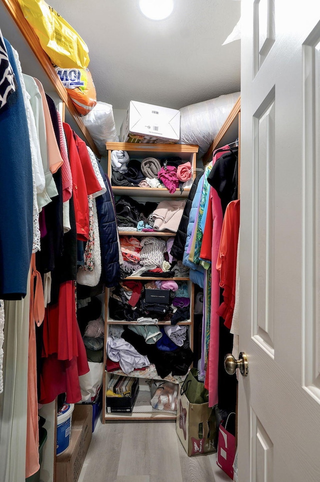 2852 S Pinehurst Ave, Springfield, MO 65807 - spacious closet featuring wood finished floors