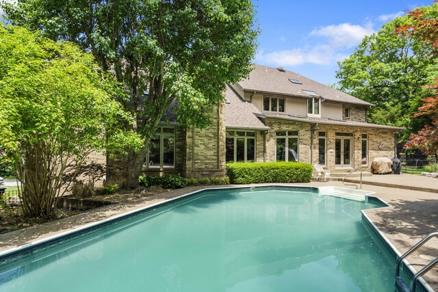 2212 E Nottingham St, Springfield, MO 65804 - outdoor pool with french doors and a patio