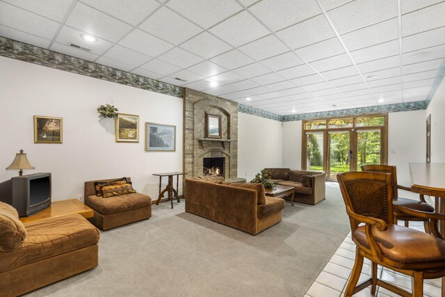 2212 E Nottingham St, Springfield, MO 65804 - living room featuring carpet flooring, a fireplace, a drop ceiling, and recessed lighting