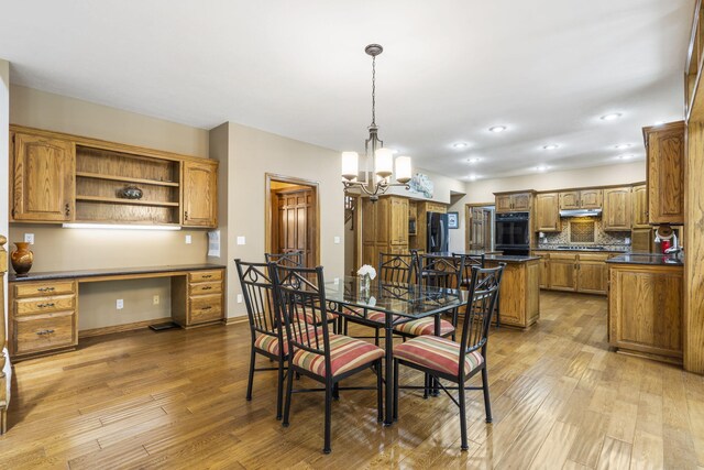 2212 E Nottingham St, Springfield, MO 65804 - dining space with light wood-style flooring, a chandelier, recessed lighting, and baseboards