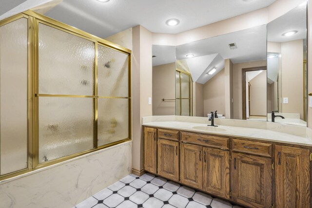 2212 E Nottingham St, Springfield, MO 65804 - bathroom featuring vanity, bath / shower combo with glass door, and tile patterned floors