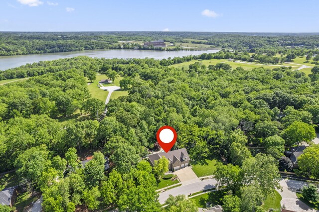 2212 E Nottingham St, Springfield, MO 65804 - aerial overview of property's location with a large body of water and a heavily wooded area
