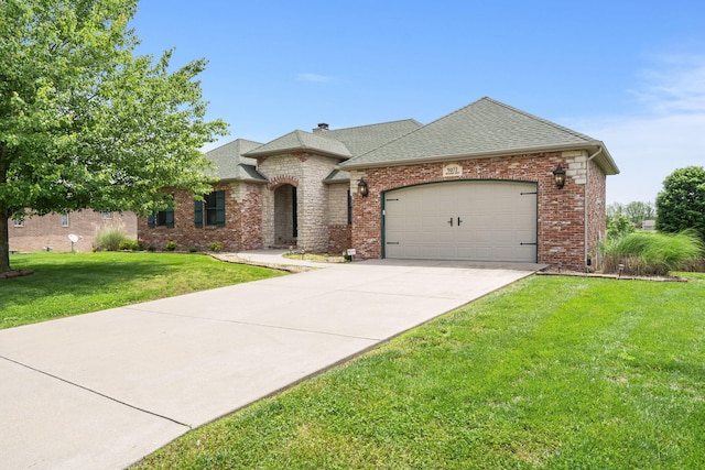 5072 E Hedgerow Dr, Springfield, MO 65802 - french country inspired facade featuring a garage, a front lawn, driveway, roof with shingles, and brick siding