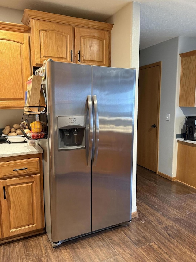1585 S Mission Ave, Bolivar, MO 65613 - kitchen featuring stainless steel fridge, dark wood-style floors, light countertops, and baseboards