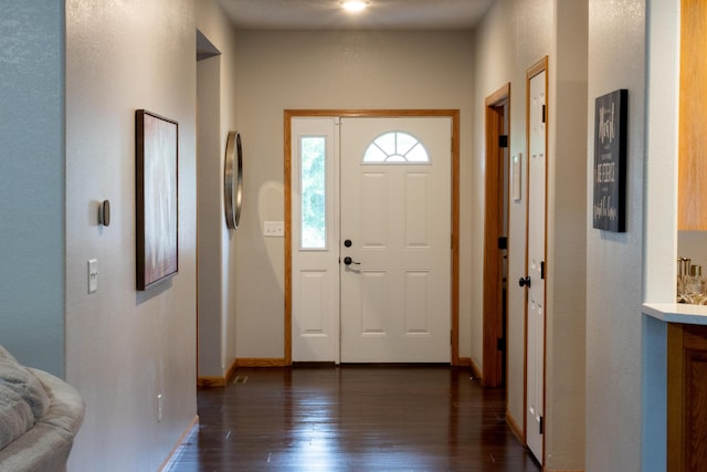 1585 S Mission Ave, Bolivar, MO 65613 - foyer entrance with dark wood-type flooring and baseboards