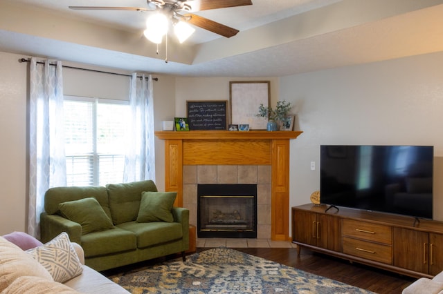 1585 S Mission Ave, Bolivar, MO 65613 - living room with ceiling fan, dark wood finished floors, and a tiled fireplace