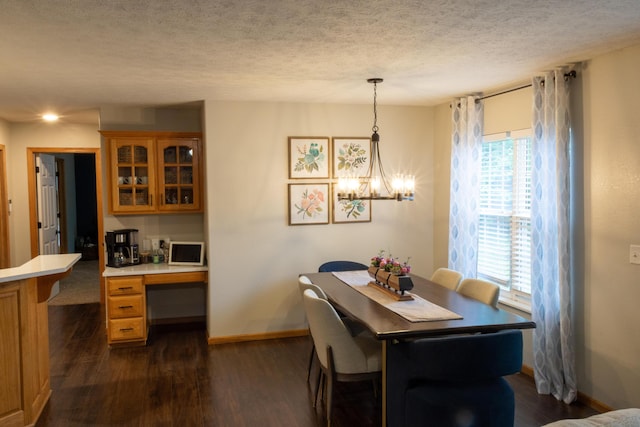 1585 S Mission Ave, Bolivar, MO 65613 - dining area featuring healthy amount of natural light, dark wood-style floors, a textured ceiling, and baseboards