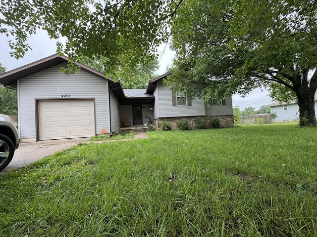 2201 S 14th St, Ozark, MO 65721 - split level home featuring a garage and asphalt driveway