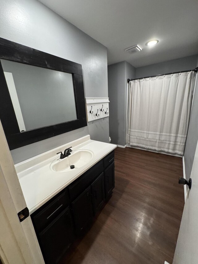 2201 S 14th St, Ozark, MO 65721 - full bath with vanity, wood finished floors, recessed lighting, and a shower with shower curtain