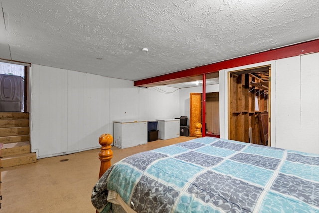 1650 Clouse Rd, Macomb, MO 65702 - carpeted bedroom with a textured ceiling, refrigerator, and washer / clothes dryer