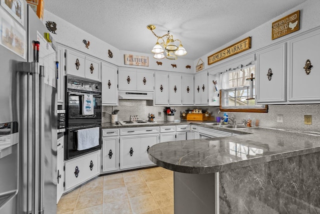 1650 Clouse Rd, Macomb, MO 65702 - kitchen with stainless steel refrigerator with ice dispenser, a sink, white cooktop, a peninsula, and a chandelier