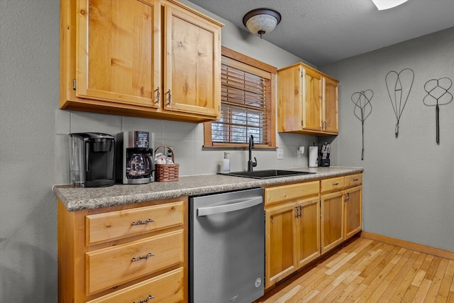 60 Mayberry Cir, Branson West, MO 65737 - kitchen featuring dishwasher, a sink, light wood finished floors, baseboards, and light countertops