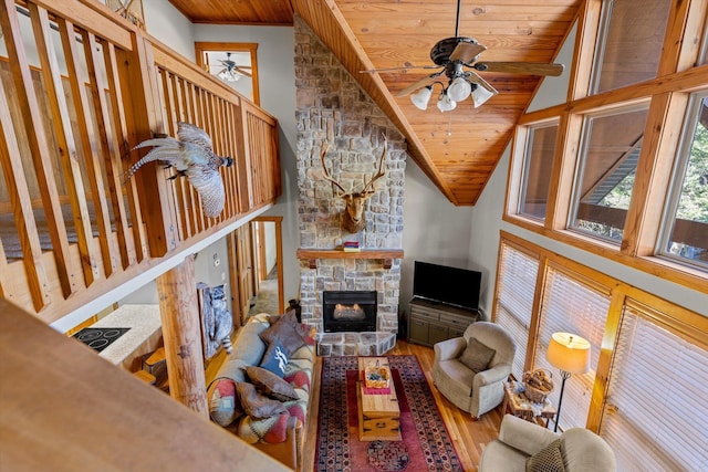 60 Mayberry Cir, Branson West, MO 65737 - living room featuring a ceiling fan, wooden ceiling, wood finished floors, a fireplace, and lofted ceiling