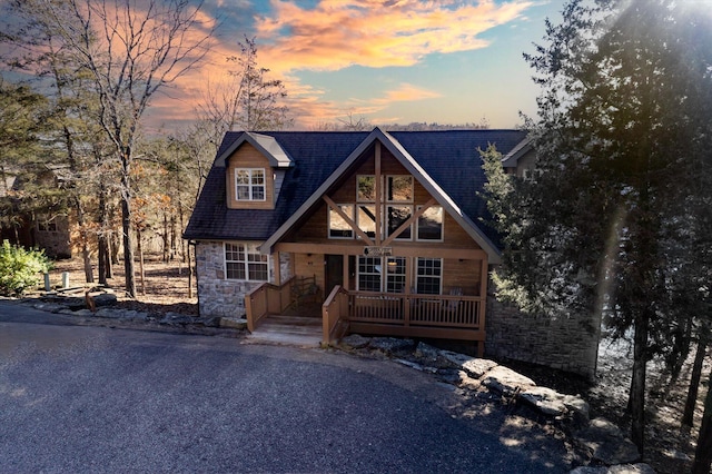 60 Mayberry Cir, Branson West, MO 65737 - rustic home with stone siding and a porch