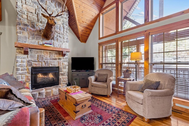 60 Mayberry Cir, Branson West, MO 65737 - living area with hardwood / wood-style flooring, a fireplace, wood ceiling, and high vaulted ceiling