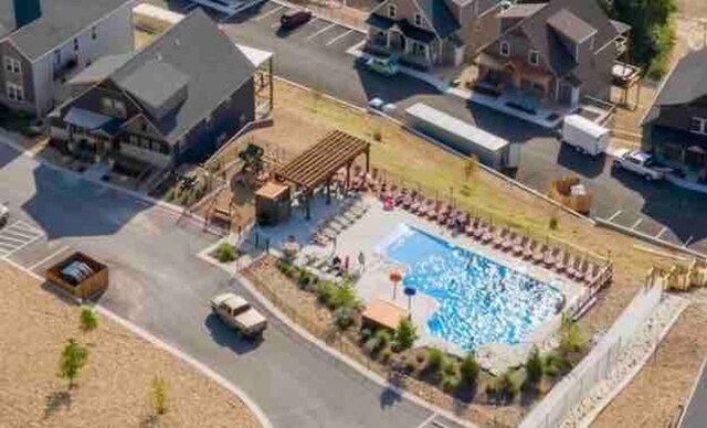 240 Chateau Cove Dr, Branson, MO 65616 - aerial perspective of suburban area with a pool area