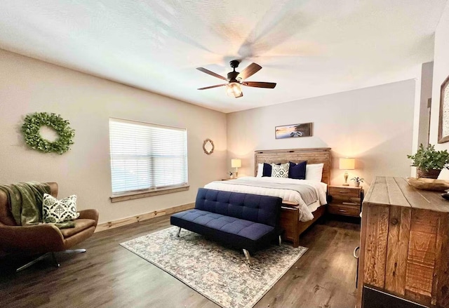 240 Chateau Cove Dr, Branson, MO 65616 - bedroom with dark wood-type flooring, baseboards, and a ceiling fan