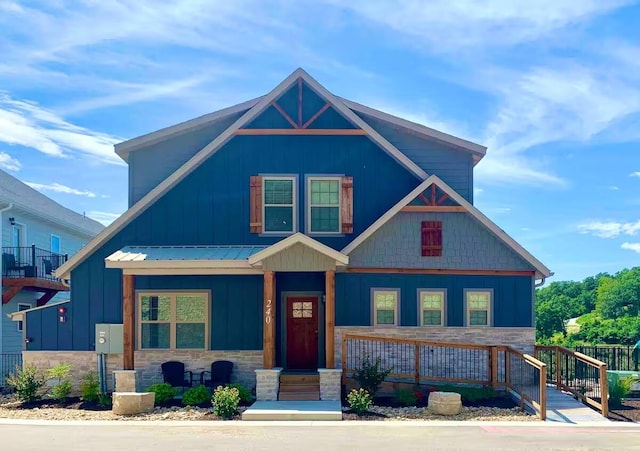 240 Chateau Cove Dr, Branson, MO 65616 - view of front of home featuring stone siding, a porch, and board and batten siding