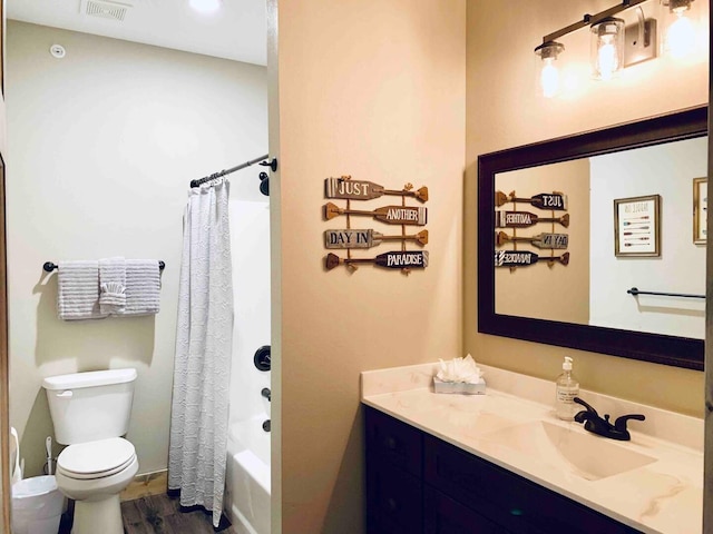 240 Chateau Cove Dr, Branson, MO 65616 - bathroom with vanity, toilet, wood finished floors, and shower / bath combination with curtain