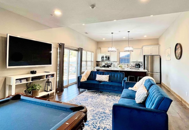 240 Chateau Cove Dr, Branson, MO 65616 - living room with dark wood finished floors, pool table, baseboards, and recessed lighting