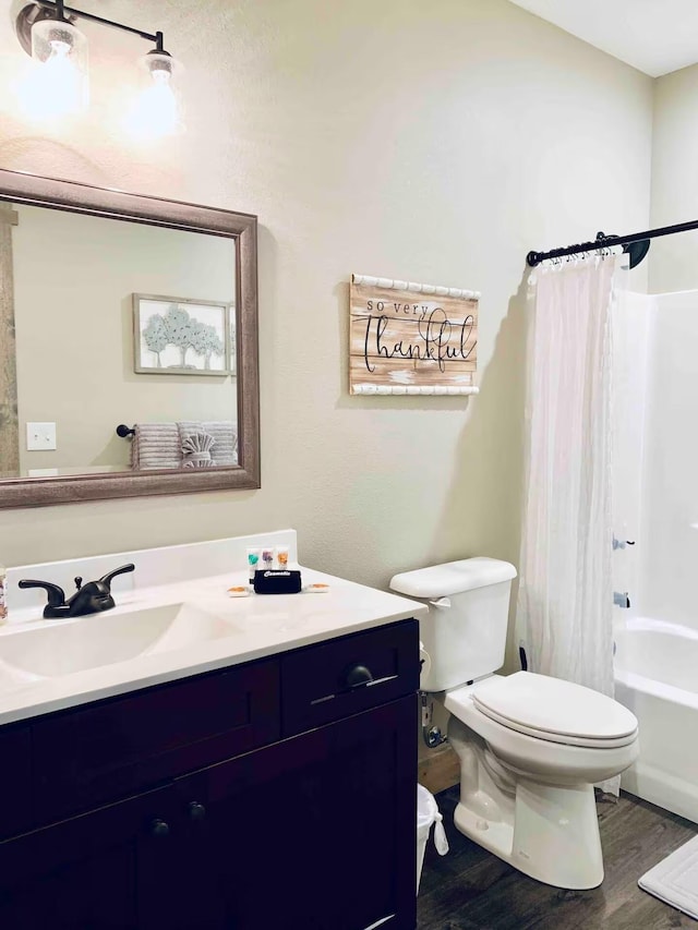 240 Chateau Cove Dr, Branson, MO 65616 - full bath with vanity, toilet, wood finished floors, and shower / tub combo with curtain